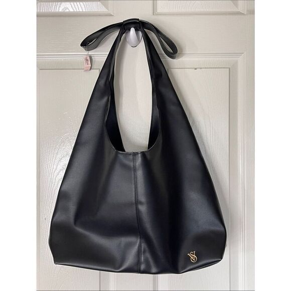 Victoria's Secret Handbags - Victoria’s Secret black faux leather hobo bow bag NWT